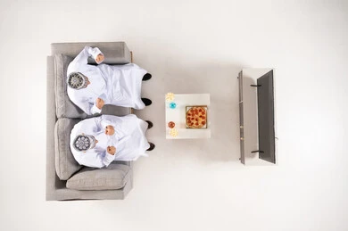 Omani Men Watching Television Top View Studio Shot