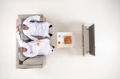 Omani Men Watching TV Top View Overhead
