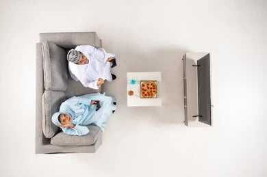 Omani Couple Playing Video Games Top Down View