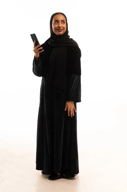 Saudi Woman in Black Abaya Holding Smartphone
