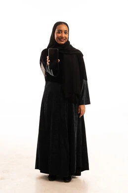 Saudi Woman with Smartphone Screen on White Background Saudi Woman with Smartphone Screen on White Background