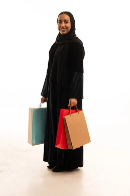 Arab Woman in Black Abaya Holding Shopping Bags