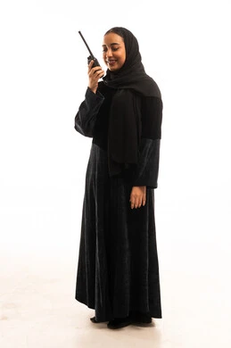 Saudi Woman in Black Abaya Holding Walkie-Talkie Studio