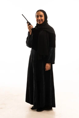 Saudi Woman in Abaya Holding Walkie-talkie in Studio Saudi Woman in Abaya Holding Walkie-talkie in Studio