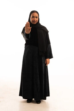 Saudi Woman in Abaya Making Stop Gesture Studio