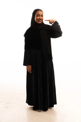 Saudi Woman in Black Abaya Pointing at Face Studio