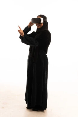 Saudi Woman Wearing VR Goggles in Black Abaya
