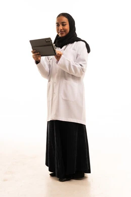 Saudi Female Physician Using Tablet in Studio