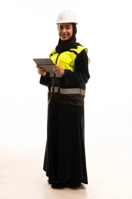 Saudi Female Engineer in Safety Gear with Tablet