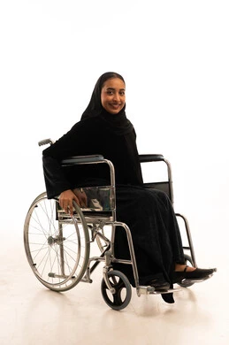 Saudi Woman in Wheelchair on White Background Saudi Woman in Wheelchair on White Background