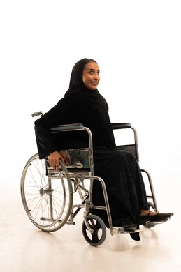 Saudi Woman in Wheelchair Wearing Abaya Studio