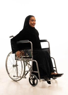 Saudi Woman in Wheelchair Wearing Black Abaya