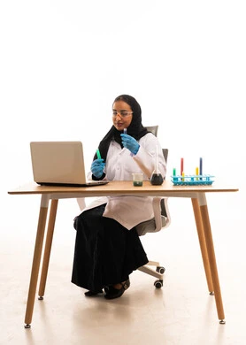 Saudi Female Scientist in Lab Coat with Laptop