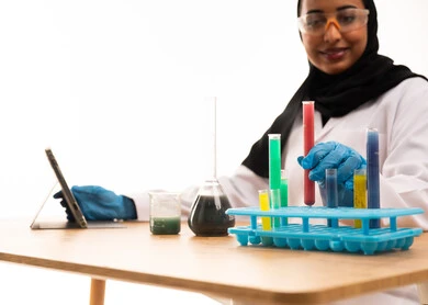 Arab Female Scientist in Laboratory with Test Tubes