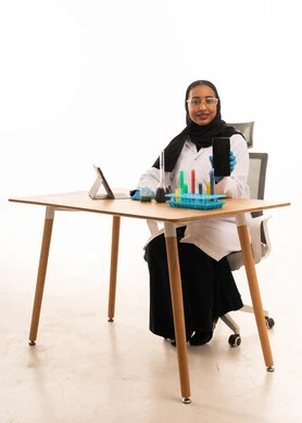 Saudi Female Scientist Holding Smartphone in Lab