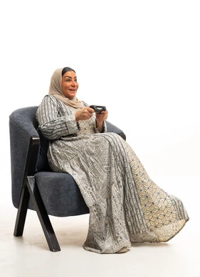 Arab Woman Playing Video Games in Traditional Dress