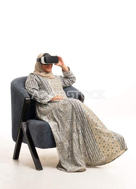 Arab Woman Using VR Headset in Traditional Hijab Dress - Photo