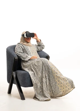 Arab Woman Using VR Headset in Traditional Hijab Dress
