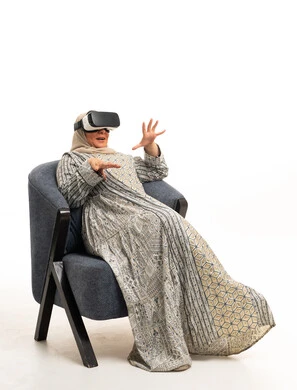 Arab Woman Wearing VR Headset in Traditional Dress
