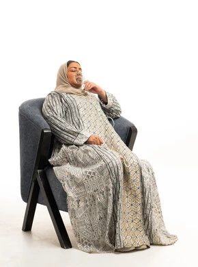 Arab Woman Using Medical Nebulizer in Studio Setup