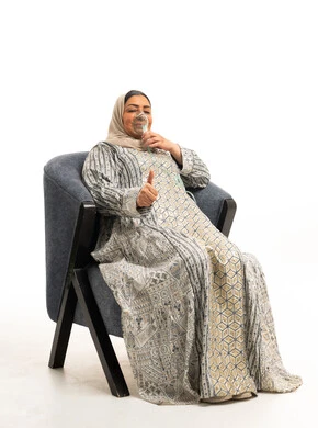 Saudi Woman Using Nebulizer Mask on White Background