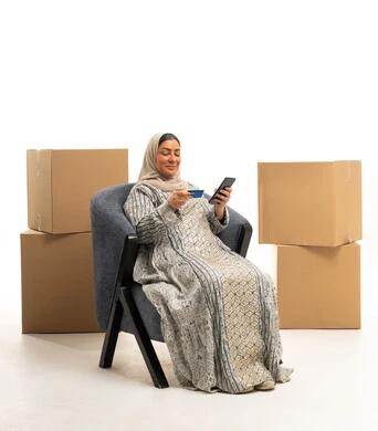 Arab Woman Shopping Online with Credit Card and Boxes