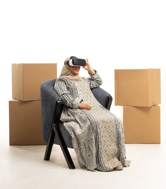 Arab Woman Wearing VR Headset Near Shipping Boxes