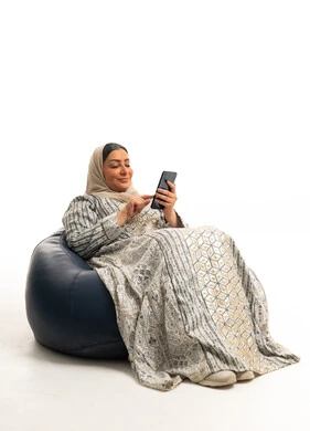 Saudi Woman Using Smartphone on Bean Bag