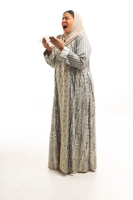 Saudi Woman Sneezing into Tissue on White Background