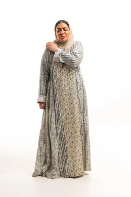 Saudi Woman with Shoulder Pain in Traditional Jalabiya Saudi Woman with Shoulder Pain in Traditional Jalabiya