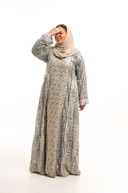 Emirati Woman in Traditional Jalabiya with Headache Emirati Woman in Traditional Jalabiya with Headache