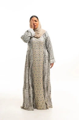 Saudi Woman in Traditional Abaya with Eye Pain