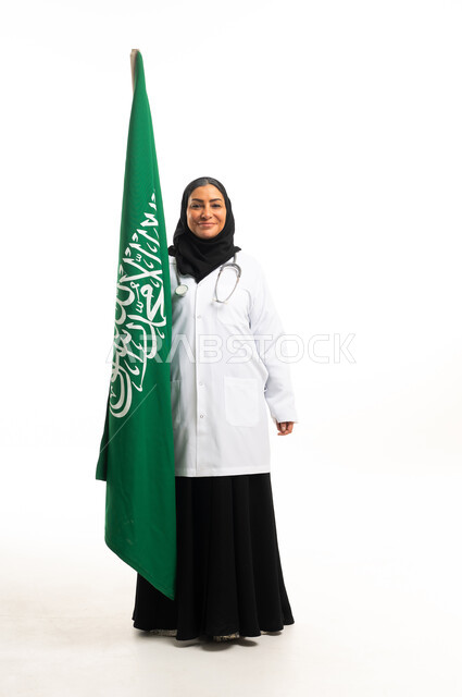 Saudi Female Doctor Holding Saudi Flag on White Background - Photo