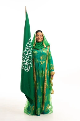 Saudi Woman with National Flag in Traditional Dress
