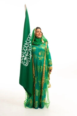 Saudi Woman with National Flag in Traditional Dress