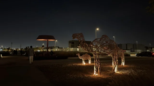 Camel Sculptures in Ahmed Al-Mousa Park at Night