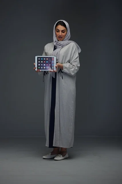 Saudi Woman Holding Digital Tablet in Studio