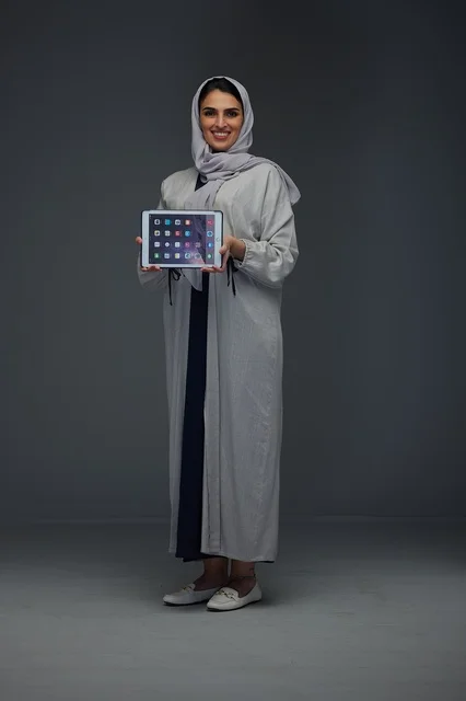 Saudi Woman Holding Digital Tablet in Studio