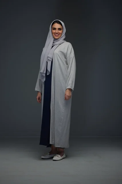 Saudi Woman in Gray Abaya Standing in Studio