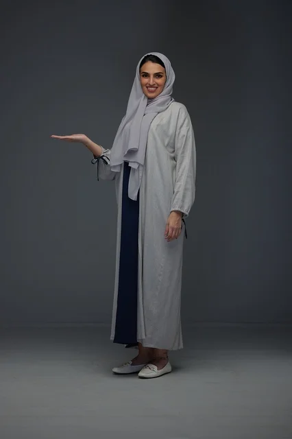 Saudi Woman in Grey Abaya Presenting Side Gesture