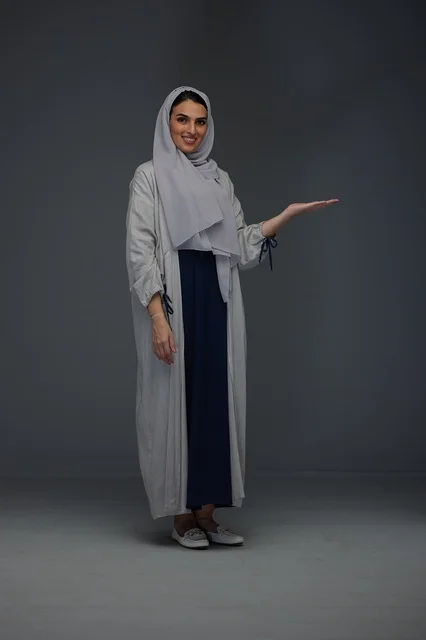 Saudi Woman in Grey Abaya Gesturing in Studio