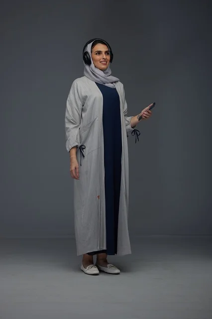 Saudi Woman with Headphones in Studio Portrait