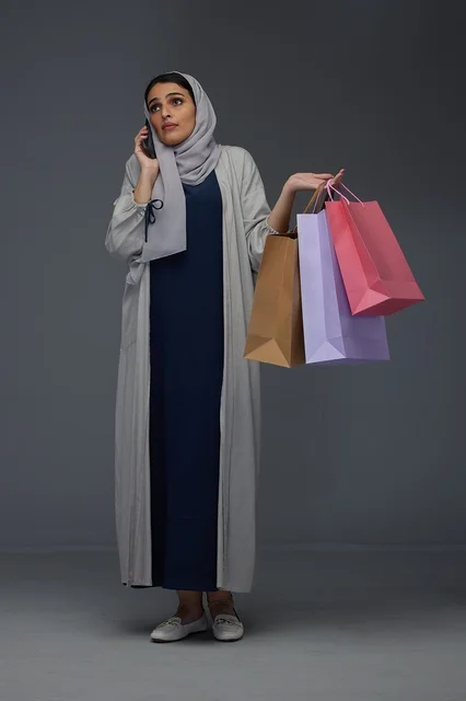 Saudi Woman Holding Shopping Bags with Smile