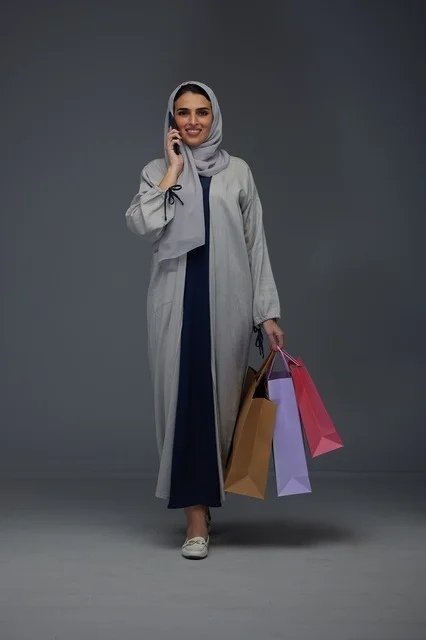 Saudi Woman Shopping and Talking on Phone in Studio