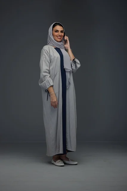 Saudi Woman in Abaya Talking on Smartphone Studio