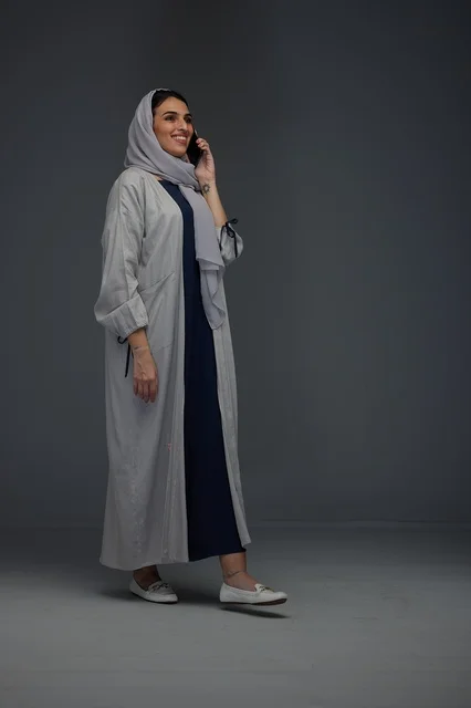 Saudi Woman in Abaya Talking on Smartphone in Studio