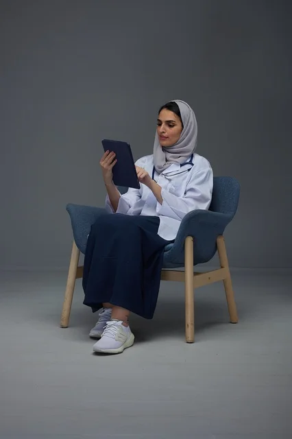 Saudi Female Doctor Using Tablet in Studio Setting
