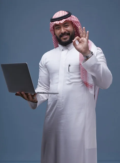 Saudi Man with Laptop Making OK Gesture