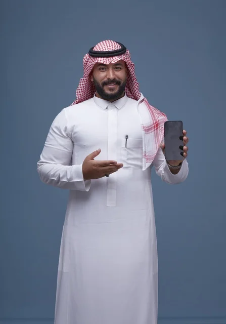 Saudi Man Holding Smartphone with Blank Screen