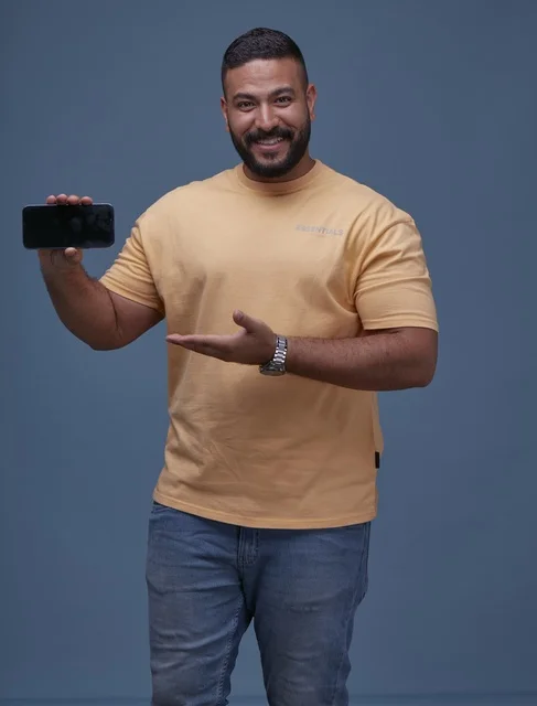 Smiling Saudi Man Holding Blank Smartphone Screen